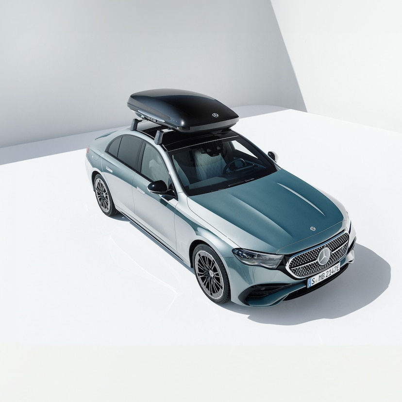 A silver Mercedes-Benz with carrier.