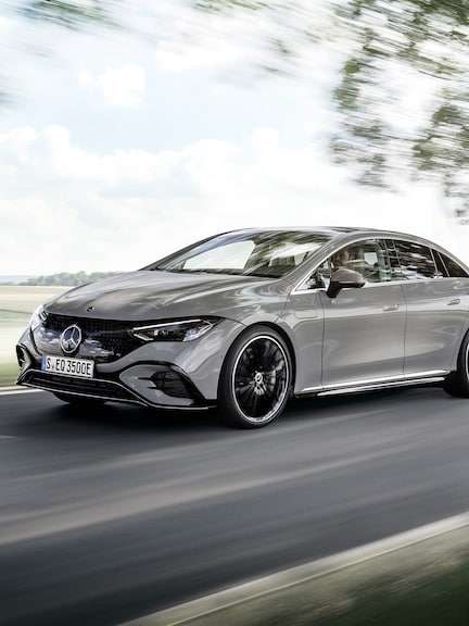 Mercedes-Benz | Land Sea Air | EQS Angled front view of an EQS on a country road